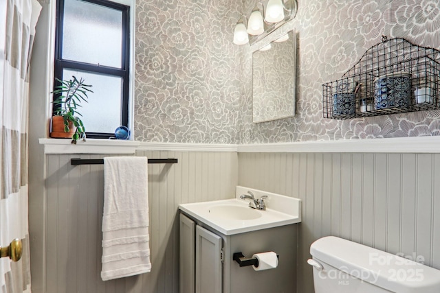 615 Biltmore Ave Unit K2, Asheville, NC 28803 - bathroom with wallpapered walls, wainscoting, vanity, and toilet