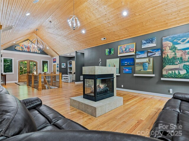 105 Blackberry Ln, Fairview, NC 28730 - living room featuring a chandelier, vaulted ceiling, wood finished floors, baseboards, and recessed lighting