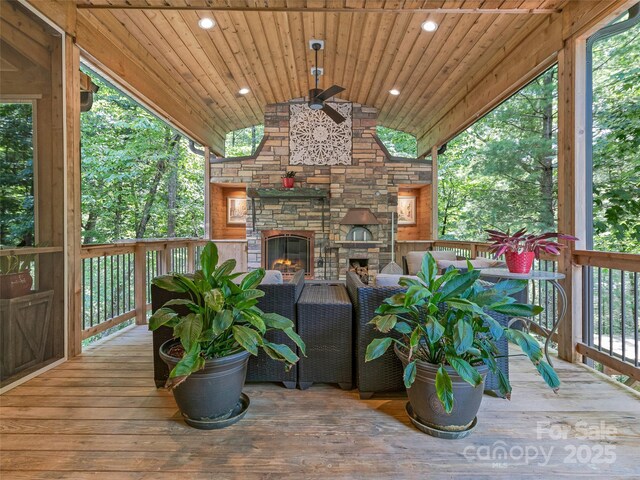 105 Blackberry Ln, Fairview, NC 28730 - wooden deck featuring an outdoor stone fireplace and a ceiling fan