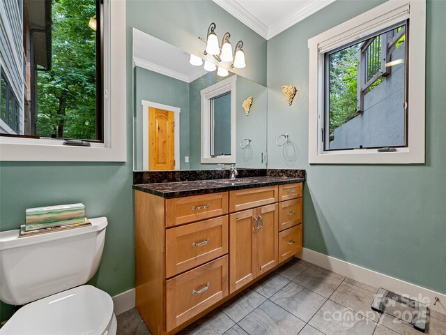 105 Blackberry Ln, Fairview, NC 28730 - bathroom with ornamental molding, vanity, baseboards, and toilet
