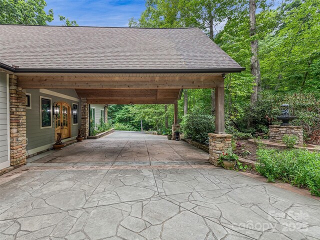 105 Blackberry Ln, Fairview, NC 28730 - view of car parking with asphalt driveway and a carport
