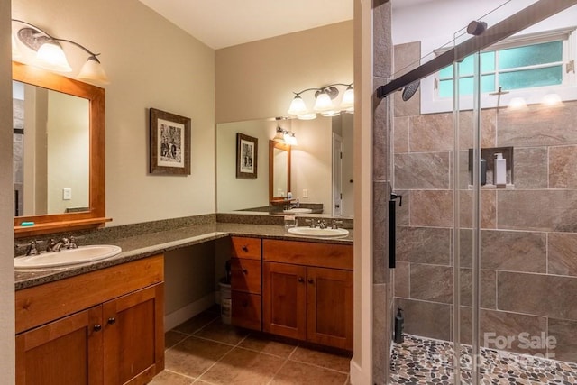 45 Boulder Creek Ln Unit 28, Tuckasegee, NC 28783 - bathroom featuring a shower stall, two vanities, and tile patterned flooring