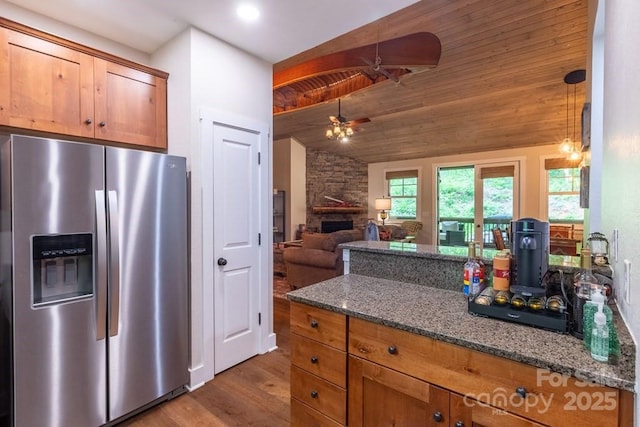45 Boulder Creek Ln Unit 28, Tuckasegee, NC 28783 - kitchen featuring stainless steel refrigerator with ice dispenser, lofted ceiling, dark stone counters, ceiling fan, and dark wood-type flooring