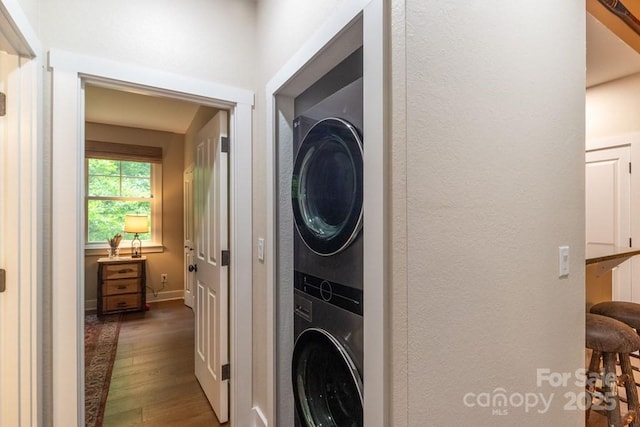 45 Boulder Creek Ln Unit 28, Tuckasegee, NC 28783 - laundry room featuring stacked washer / drying machine, wood finished floors, and a textured wall
