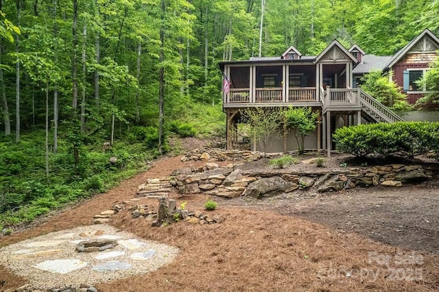 45 Boulder Creek Ln Unit 28, Tuckasegee, NC 28783 - back of house featuring a sunroom, a forest view, and stairway