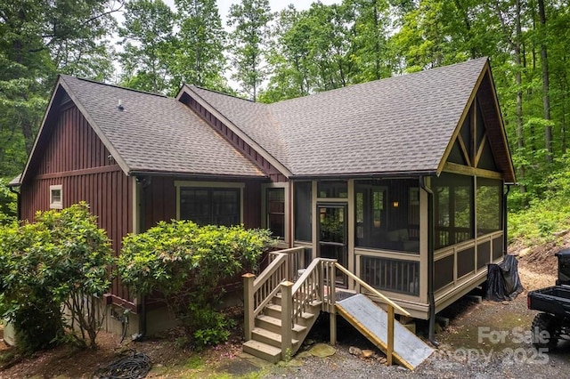 45 Boulder Creek Ln Unit 28, Tuckasegee, NC 28783 - rear view of property featuring a shingled roof, a sunroom, and board and batten siding