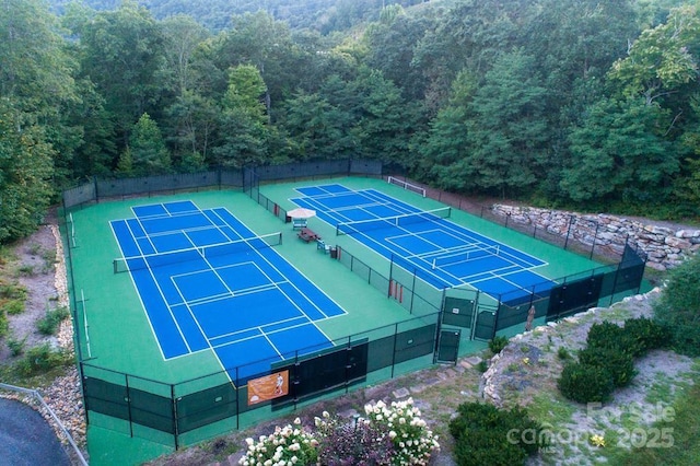 45 Boulder Creek Ln Unit 28, Tuckasegee, NC 28783 - view of tennis court featuring a forest view