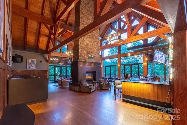 45 Boulder Creek Ln Unit 28, Tuckasegee, NC 28783 - reception area with high vaulted ceiling, a fireplace, a chandelier, and wood ceiling with exposed beams