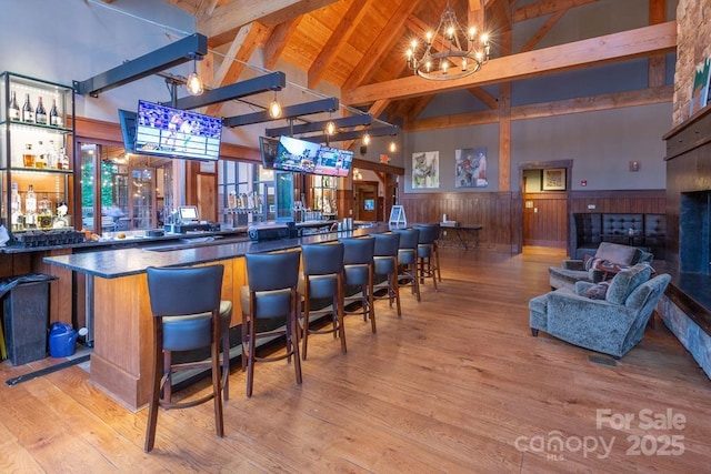 45 Boulder Creek Ln Unit 28, Tuckasegee, NC 28783 - community bar area with high vaulted ceiling, beamed ceiling, a chandelier, wood finished floors, and wainscoting