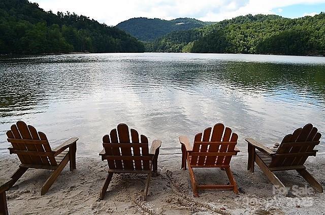 45 Boulder Creek Ln Unit 28, Tuckasegee, NC 28783 - water view with a heavily wooded area and a mountainous background