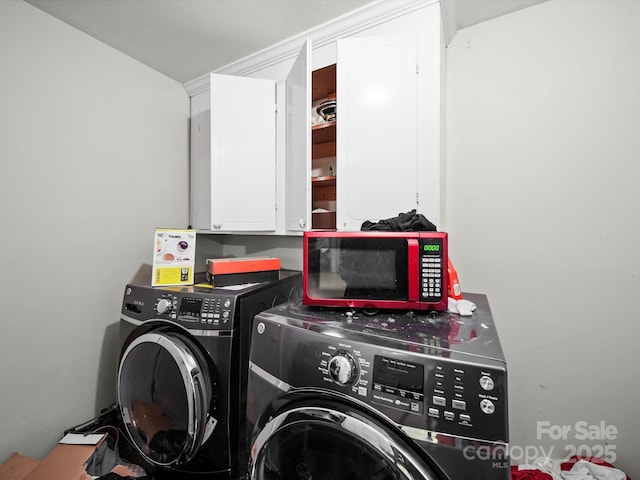 1004 E 8th Ave, Gastonia, NC 28054 - washroom featuring cabinet space and washer and clothes dryer
