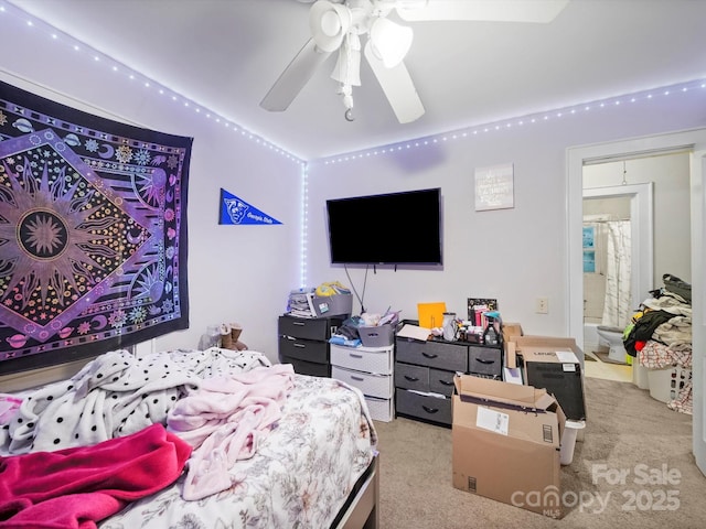 1004 E 8th Ave, Gastonia, NC 28054 - carpeted bedroom featuring a ceiling fan and ensuite bath