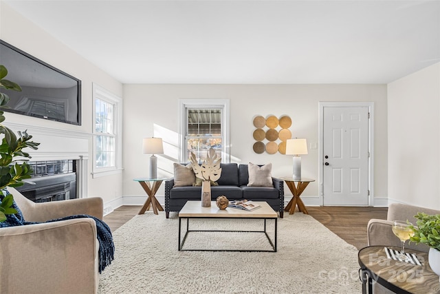 3726 The Plz, Charlotte, NC 28205 - living area featuring wood finished floors, a glass covered fireplace, and baseboards
