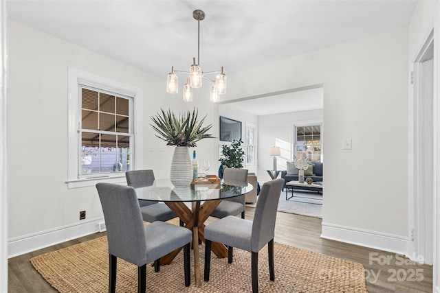 3726 The Plz, Charlotte, NC 28205 - dining room with wood finished floors, a chandelier, and baseboards