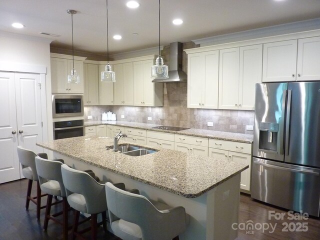 1311 Stonecroft Ln NW, Concord, NC 28027 - kitchen with appliances with stainless steel finishes, a sink, wall chimney exhaust hood, a kitchen island with sink, and a kitchen bar