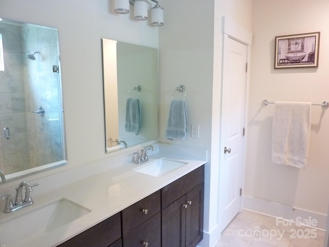 1311 Stonecroft Ln NW, Concord, NC 28027 - bathroom featuring double vanity, tile patterned floors, a tile shower, and baseboards