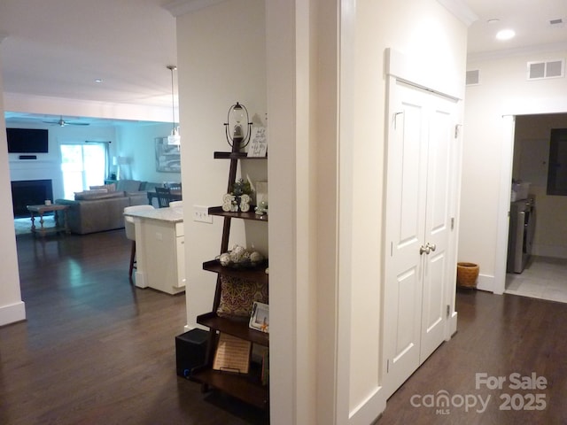 1311 Stonecroft Ln NW, Concord, NC 28027 - corridor with dark wood-style floors, recessed lighting, and crown molding
