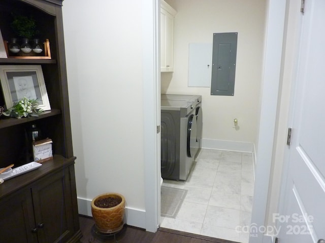 1311 Stonecroft Ln NW, Concord, NC 28027 - laundry room featuring electric panel, washer and dryer, baseboards, cabinet space, and light marble finish floors