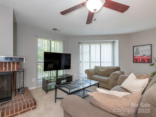 8208 Cedar Glen Dr, Charlotte, NC 28212 - living area featuring a fireplace, ceiling fan, and light carpet