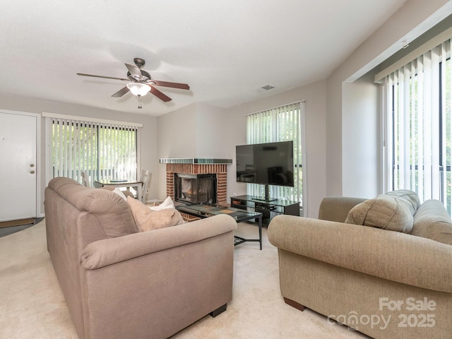 8208 Cedar Glen Dr, Charlotte, NC 28212 - living area with light colored carpet, ceiling fan, and a brick fireplace