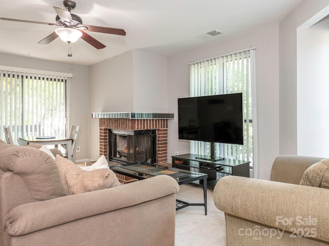 8208 Cedar Glen Dr, Charlotte, NC 28212 - carpeted living room with a brick fireplace and a ceiling fan
