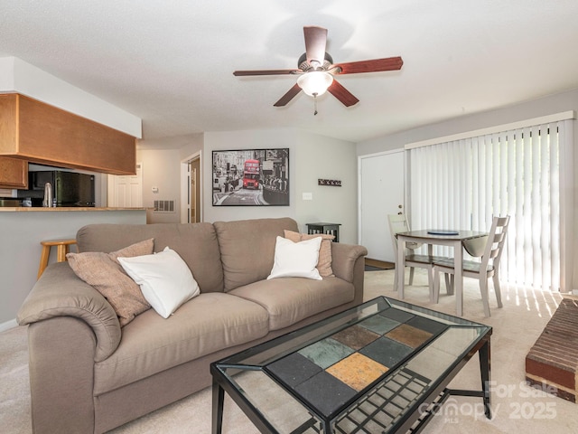 8208 Cedar Glen Dr, Charlotte, NC 28212 - living room featuring a ceiling fan and light carpet