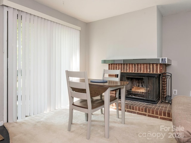 8208 Cedar Glen Dr, Charlotte, NC 28212 - carpeted dining area featuring a fireplace