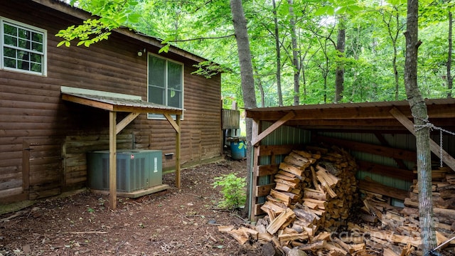 2951 Evergreen Trl, Vale, NC 28168 - view of property exterior with central air condition unit and faux log siding