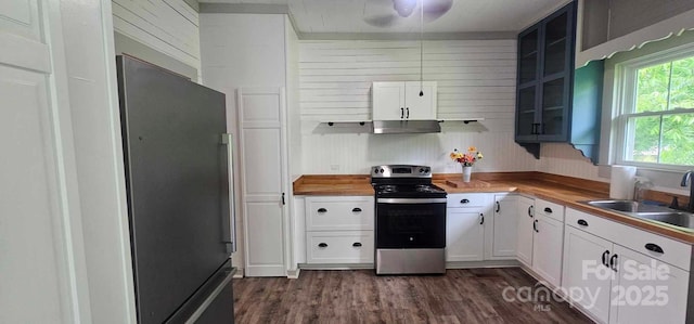 804 N Main St, Oakboro, NC 28129 - kitchen with stainless steel appliances, a sink, wooden counters, glass insert cabinets, and dark wood finished floors