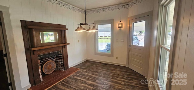 804 N Main St, Oakboro, NC 28129 - entrance foyer with dark wood finished floors, baseboards, and a fireplace