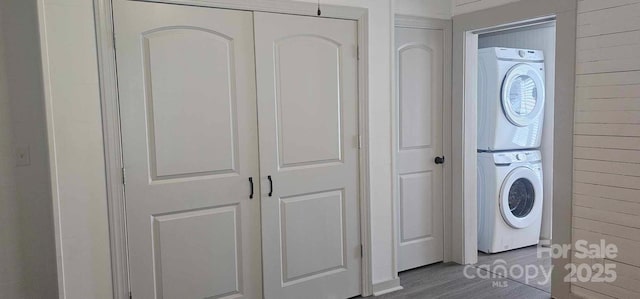 804 N Main St, Oakboro, NC 28129 - laundry room with stacked washer / drying machine and wood finished floors