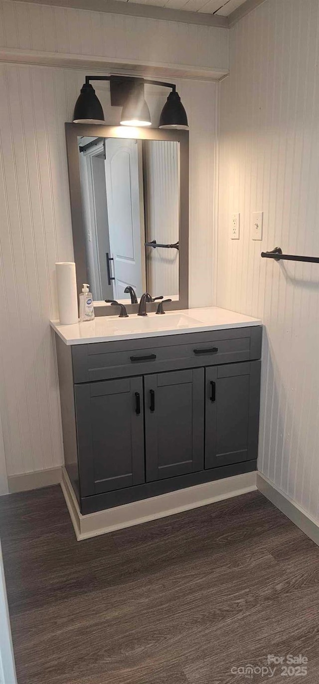 804 N Main St, Oakboro, NC 28129 - bathroom featuring wood finished floors, vanity, and baseboards