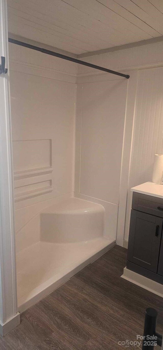804 N Main St, Oakboro, NC 28129 - bathroom featuring wood finished floors, walk in shower, and vanity