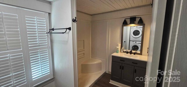 804 N Main St, Oakboro, NC 28129 - bathroom featuring estacked washer and dryer, vanity, a shower, wood finished floors, and wood ceiling