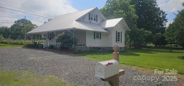 804 N Main St, Oakboro, NC 28129 - view of front of property featuring covered porch, a front yard, metal roof, and crawl space