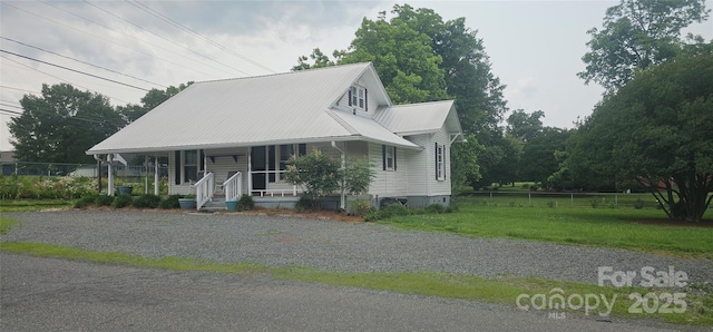 804 N Main St, Oakboro, NC 28129 - view of front of property with a porch and metal roof