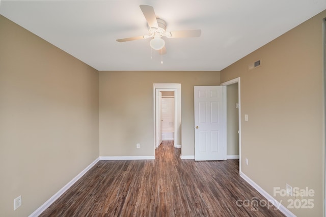 809 High Meadow Ln Unit F, Charlotte, NC 28217 - unfurnished bedroom with dark wood finished floors, baseboards, and ceiling fan