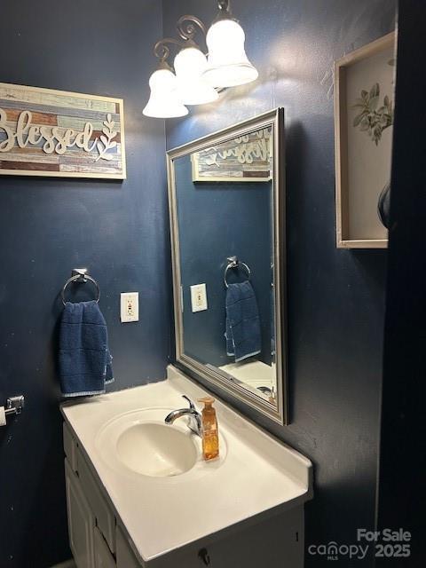 114 Wayne Ave, Kannapolis, NC 28081 - bathroom with a chandelier and vanity