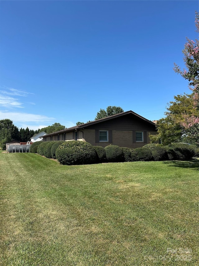 1410 Patterson St, China Grove, NC 28023 - view of property exterior featuring a lawn