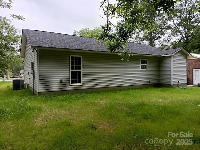 12 Watts St, York, SC 29745 - rear view of property featuring central AC and roof with shingles