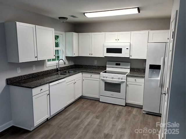12 Watts St, York, SC 29745 - kitchen featuring white appliances, a sink, dark wood-type flooring, and white cabinetry
