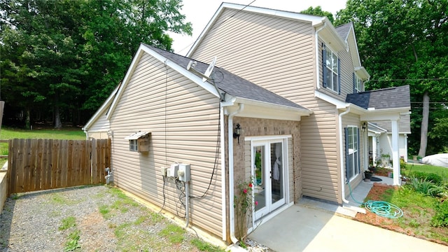 7046 Dorn Cir, Charlotte, NC 28212 - view of home's exterior with a patio and a shingled roof
