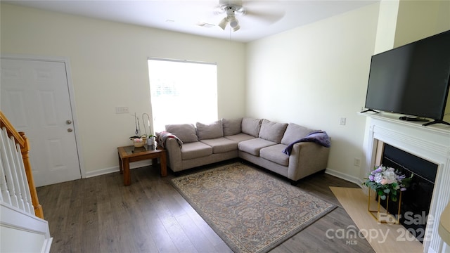 7046 Dorn Cir, Charlotte, NC 28212 - living room with ceiling fan, wood finished floors, a fireplace with flush hearth, and baseboards
