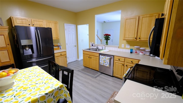 7046 Dorn Cir, Charlotte, NC 28212 - kitchen featuring fridge with ice dispenser, dishwasher, light brown cabinetry, range with electric cooktop, and light countertops