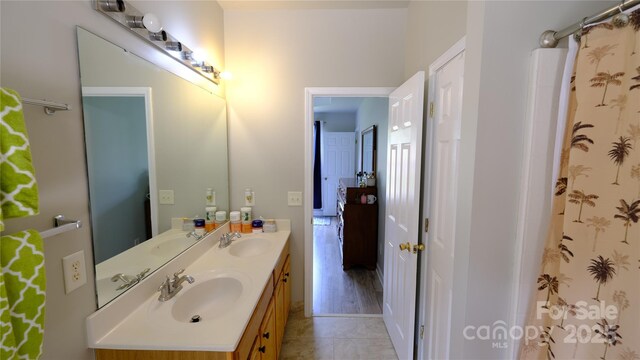 7046 Dorn Cir, Charlotte, NC 28212 - full bathroom featuring double vanity and tile patterned floors