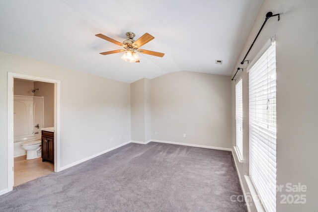 9800 Walkers Glen Dr NW, Concord, NC 28027 - unfurnished bedroom with lofted ceiling, carpet floors, baseboards, connected bathroom, and a ceiling fan