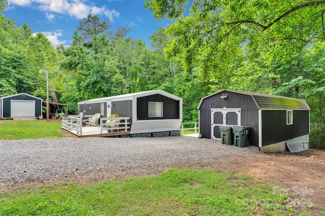 2289 Mccloud St, Denver, NC 28037 - view of front of property featuring a wooden deck and a detached garage