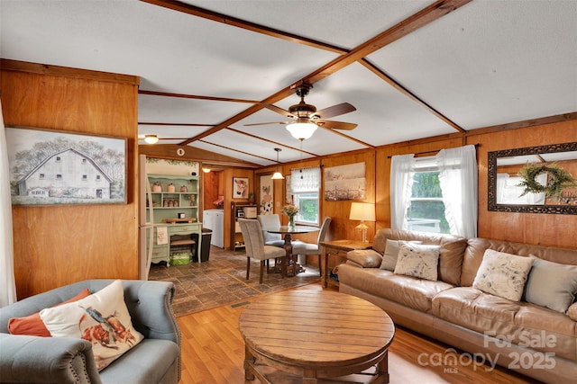 2289 Mccloud St, Denver, NC 28037 - living area featuring wood walls, plenty of natural light, ceiling fan, and wood finished floors