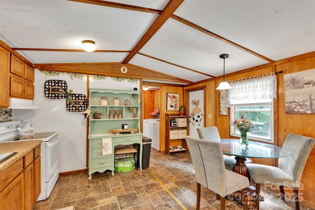 2289 Mccloud St, Denver, NC 28037 - dining space featuring washer and clothes dryer, stone tile floors, wooden walls, vaulted ceiling, and baseboards