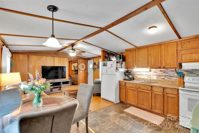 2289 Mccloud St, Denver, NC 28037 - kitchen with white appliances, light countertops, wood walls, backsplash, and brown cabinets